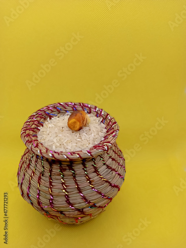 Kusha grass made pot with rice and ginger photo