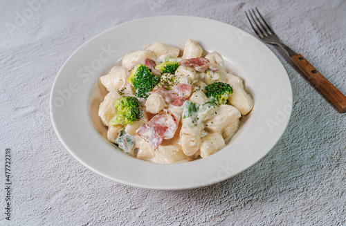 Korean food Spicy Stir-fried Carbonara tteokbokki dish on white plate