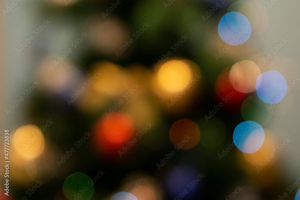 Abstract colorful defocused circular facula. Elegant background with bokeh lights and stars. Abstract circular Bokeh blurred color light can be uses as holidays background.