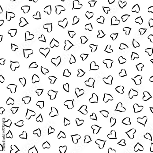 Seamless pattern of hearts. Hand-drawn cartoon cute doodle design isolated on white background.