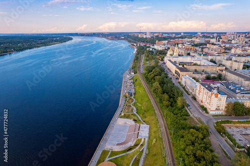 Aerial top view panorama city Perm and central embankment of Kama river Russia, sunset drone photo