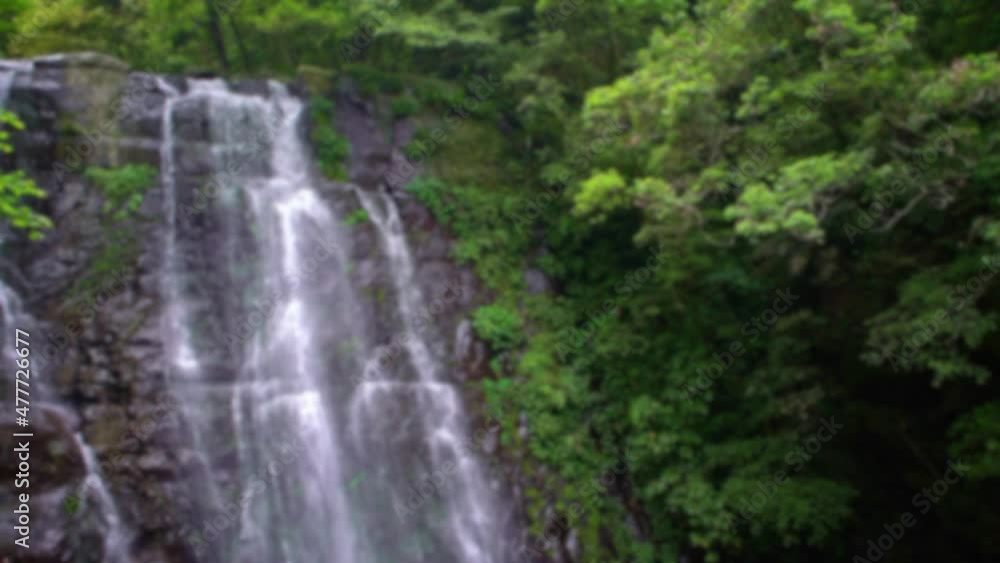 Blurred defocused view of natural beauty virgen waterfall nature. Beautiful river cascades between the trees in the wild mountain of Taiwan. Forest of Manyueyuan, national recreation area Xinbei Blurred defocused view of natural beauty virgen waterfall nature. Beautiful river cascades between the trees in the wild mountain of Taiwan. Forest of Manyueyuan, national recreation area Xinbei