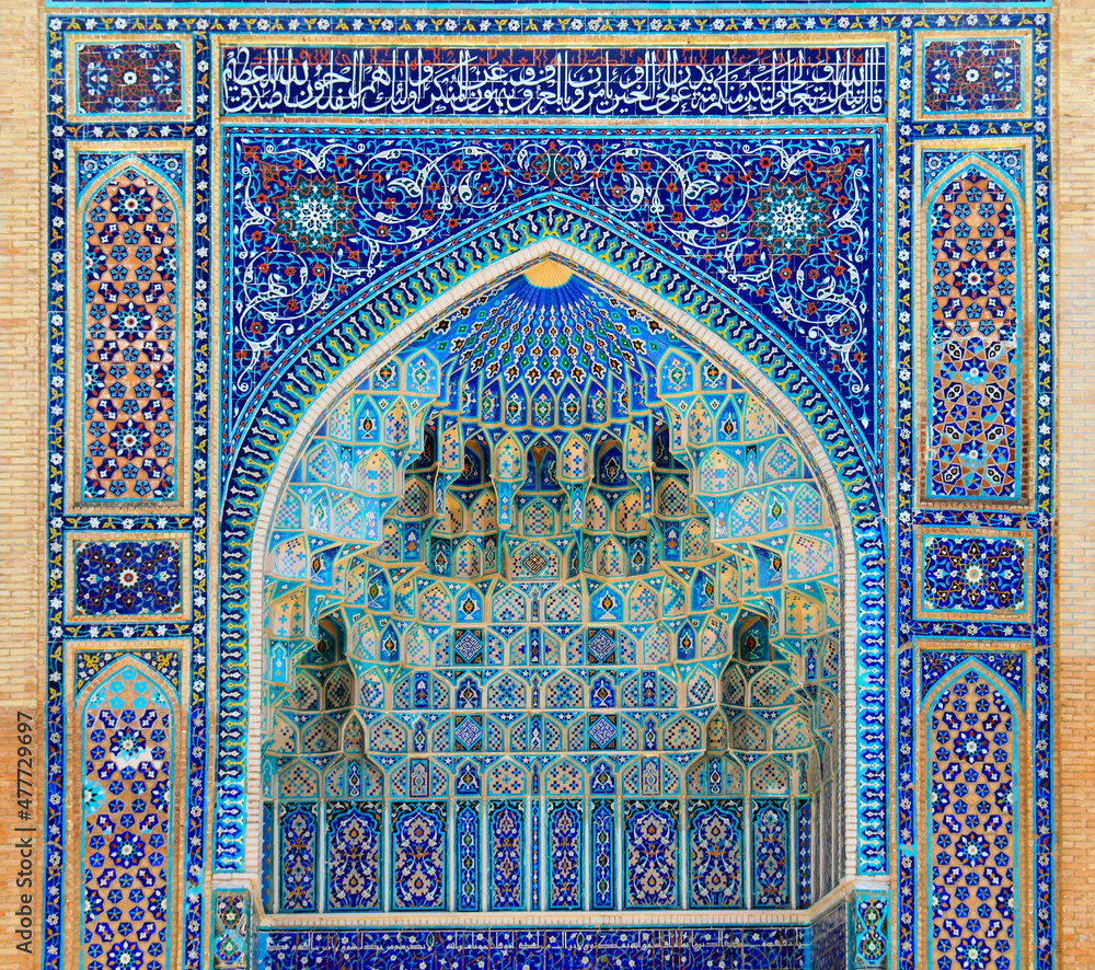 Arch portal with rich floral decoration in Ancient Mausoleum Gur Emir (Amir Timur tomb) in Samarkand, Uzbekistan. It is one of the foremost interesting place in Central Asia
