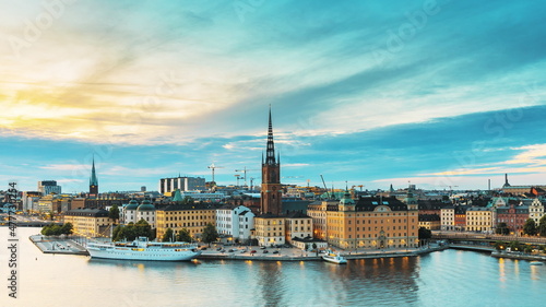 Stockholm  Sweden. Scenic View Of Stockholm Skyline At Summer Evening. Famous Popular Destination Scenic Place In Dusk Lights. Riddarholm Church In Day To Night Transition