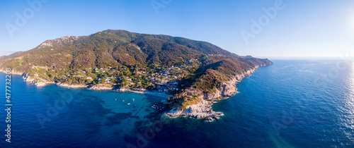 Fototapeta Naklejka Na Ścianę i Meble -  Aerial drone panorama view of the coast line, beach and crystal clear water of elba close to Sant'Andrea, Italy