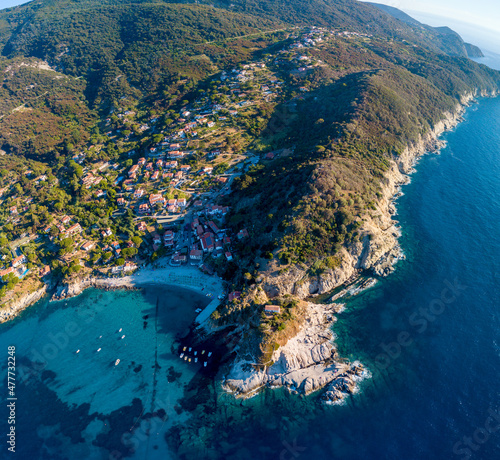 Aerial drone panorama view of the coast line, beach and crystal clear water of elba close to Sant'Andrea, Italy