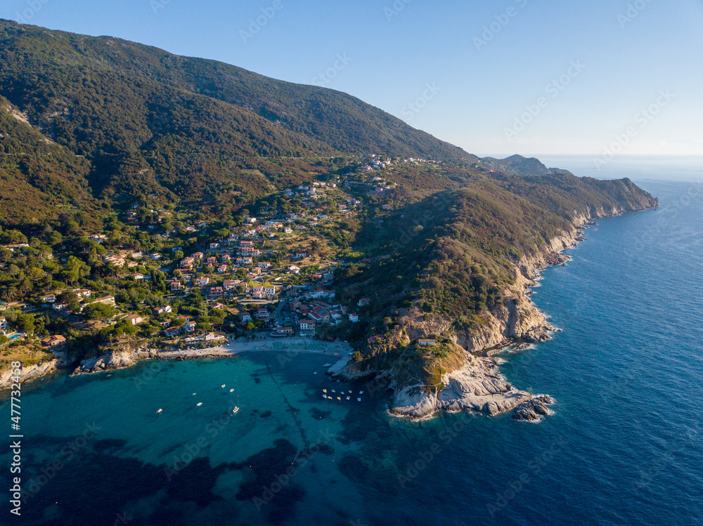 Aerial drone panorama view of the coast line, beach and crystal clear water of elba close to Sant'Andrea, Italy