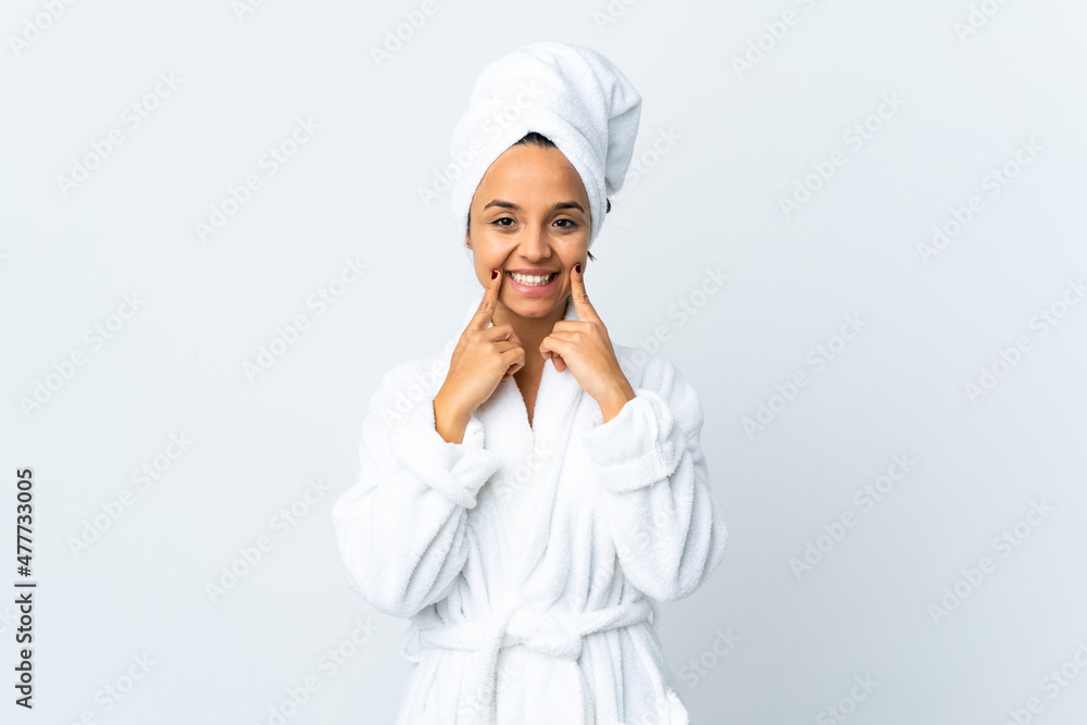 Young woman in bathrobe over isolated white background smiling with a happy and pleasant expression Young woman in bathrobe over isolated white background smiling with a happy and pleasant expression