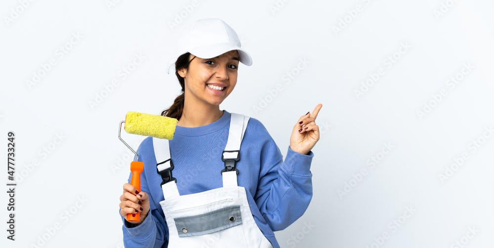 Painter woman over isolated white background happy and pointing up Painter woman over isolated white background happy and pointing up
