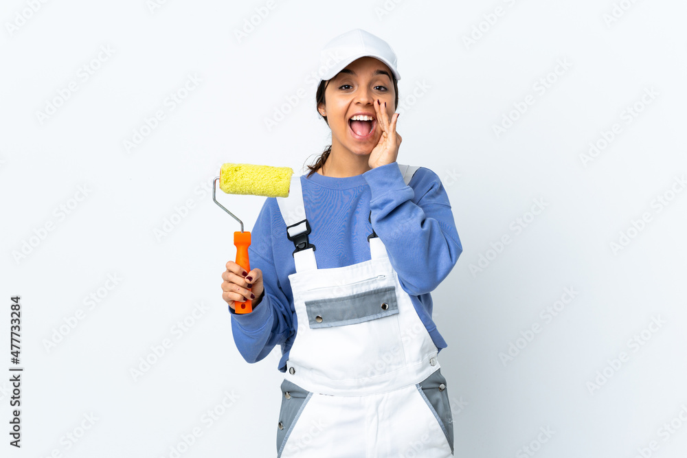 Painter woman over isolated white background shouting with mouth wide open
