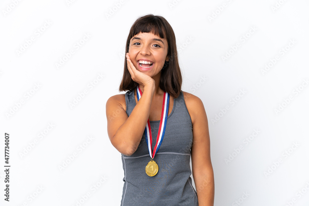 Young mixed race woman with medals isolated on white background with surprise and shocked facial expression Young mixed race woman with medals isolated on white background with surprise and shocked facial expression
