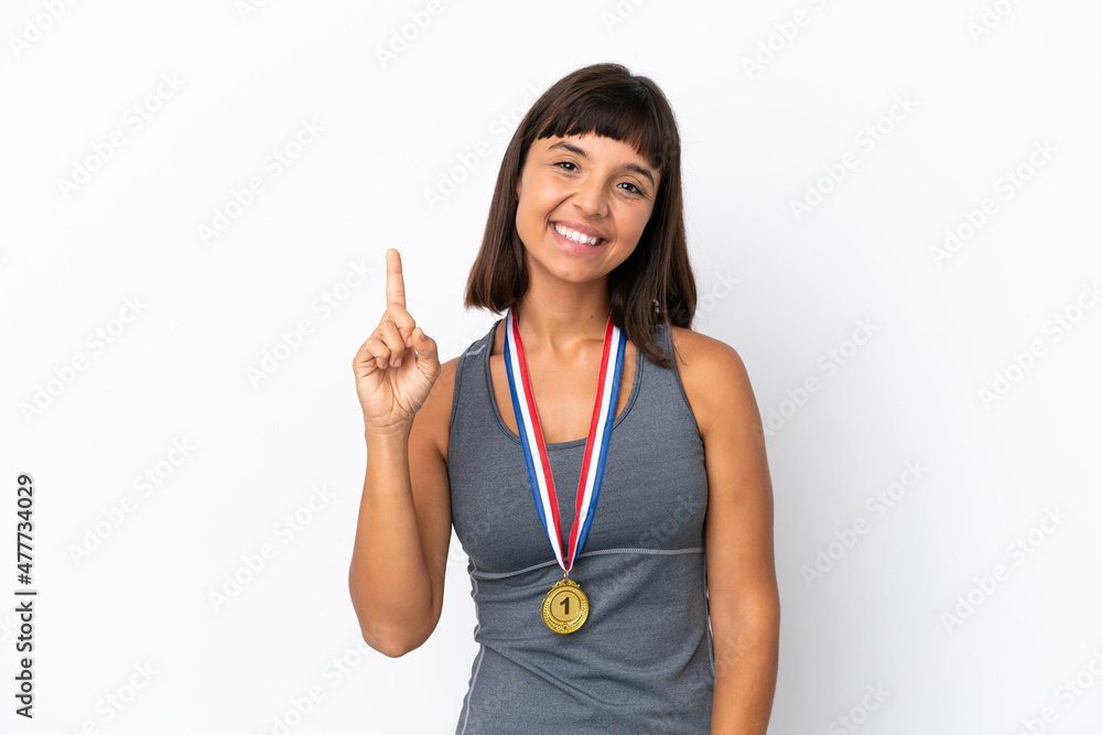 Young mixed race woman with medals isolated on white background showing and lifting a finger in sign of the best Young mixed race woman with medals isolated on white background showing and lifting a finger in sign of the best