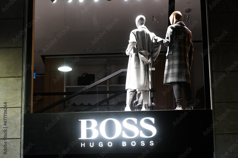 Hugo Boss logo displayed on a facade of a store in Milan. Photos | Adobe  Stock