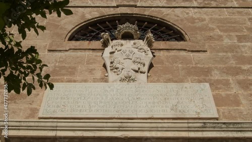 Commemorative plate in the Rosario Church, Velez de Benaudalla, Granada, Spain photo