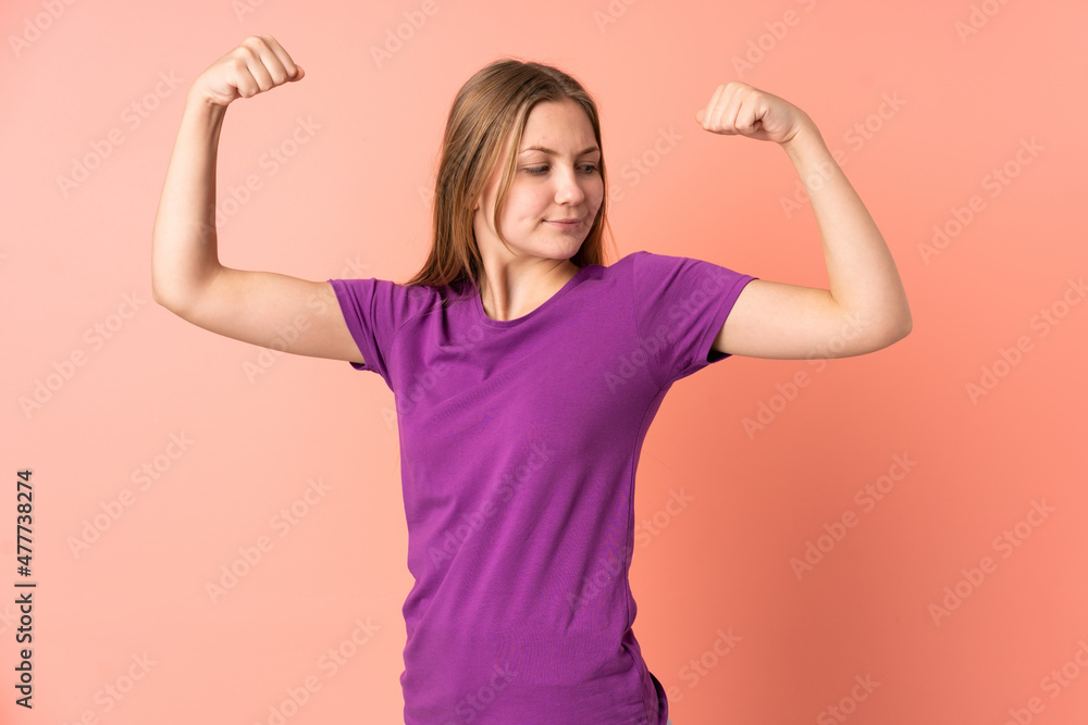 Teenager Ukrainian girl isolated on pink background doing strong gesture