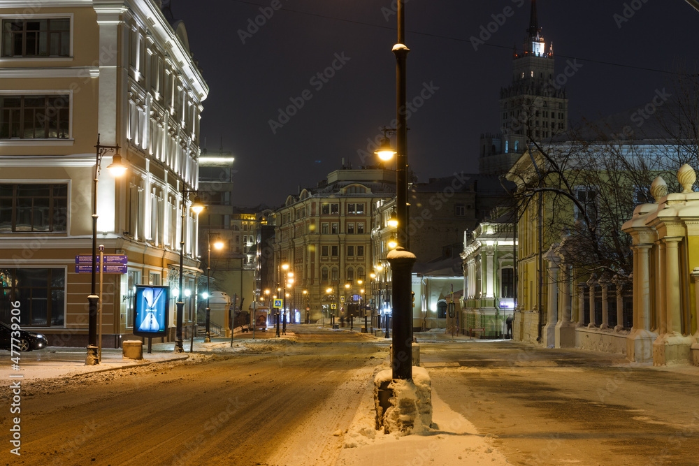 Fototapeta premium Moscow, Russia, Dec 21, 2021: Night view of Myasnitskaya street (direction to Krasnye Vorota square). Snow
