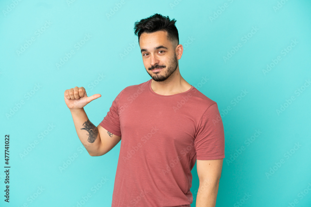 Young caucasian man isolated on blue background proud and self-satisfied Young caucasian man isolated on blue background proud and self-satisfied