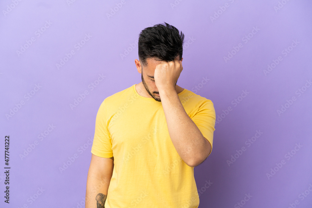 Young caucasian man isolated on purple background with headache Young caucasian man isolated on purple background with headache