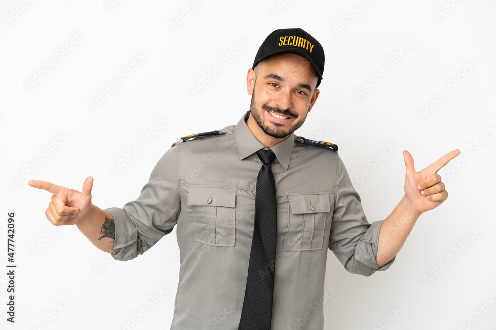 Young security caucasian man isolated on white background pointing finger to the laterals and happy Young security caucasian man isolated on white background pointing finger to the laterals and happy