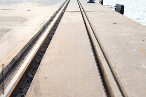 Crane runway. Pier bridge rail, cargo handling, cargo train transport away. Is structural set made of wide flange or I-Beam steel. Used for large container crane used in large ports around world.