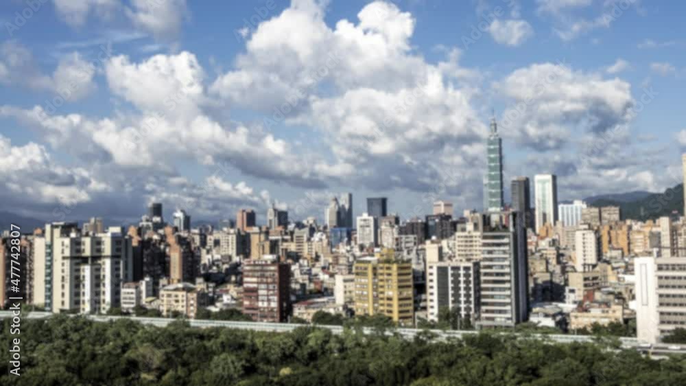 Defocused shot of timelapse Aerial View of landscape with the famed building Taipei 101. Beautiful Cityscape. Timelaps Skyscraper with background at Taiwan Defocused shot of timelapse Aerial View of landscape with the famed building Taipei 101. Beautiful Cityscape. Timelaps Skyscraper with background at Taiwan