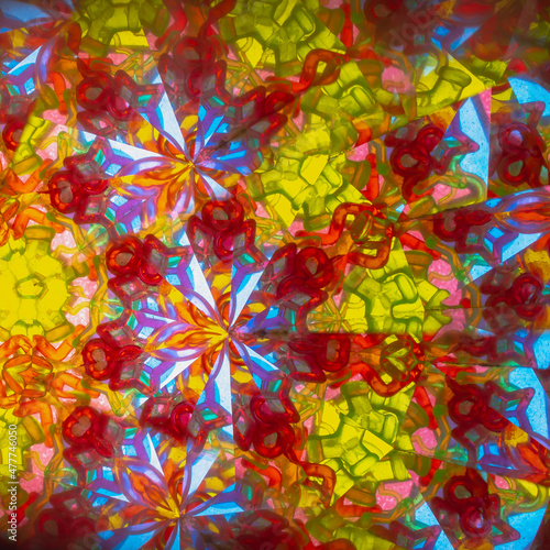 A pattern of colored glass in a kaleidoscope
