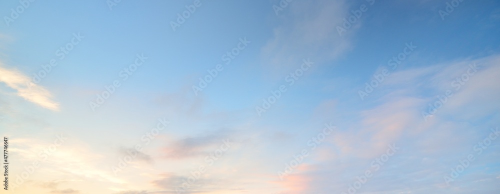 Clear blue sky with glowing pink and golden clouds after the storm. Dramatic sunset cloudscape. Concept art, meteorology, heaven, hope, peace. Graphic resources, picturesque panoramic scenery - obrazy, fototapety, plakaty 