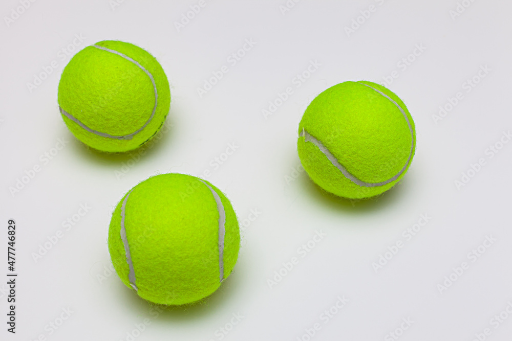 tennis ball lies on a white background