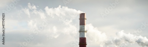 Panoramic view of the large central heating station in dramatic light. Pipe close-up. Ecology, ecological issues, fuel and power generation, environmental damage. Dark industrial cityscape photo