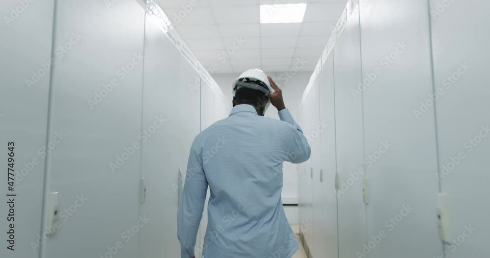 Portrait of an engineer in a hard hat holding a tablet. Portrait of an engineer in a hard hat holding a tablet.