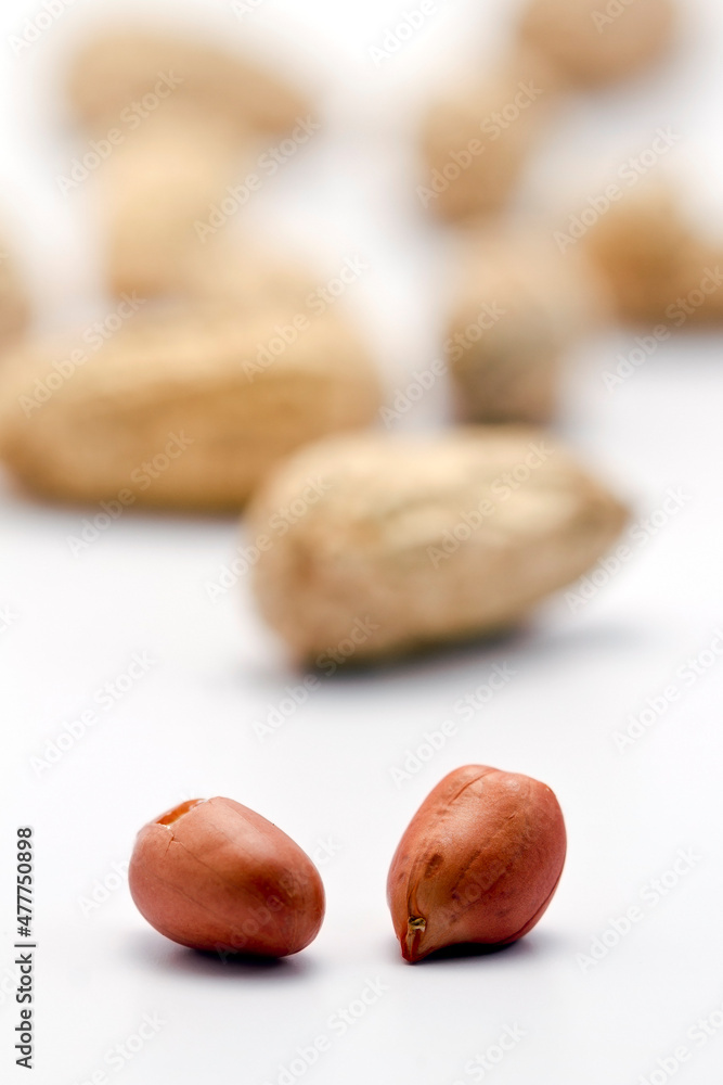 Dried peanuts in closeup on white background Dried peanuts in closeup on white background