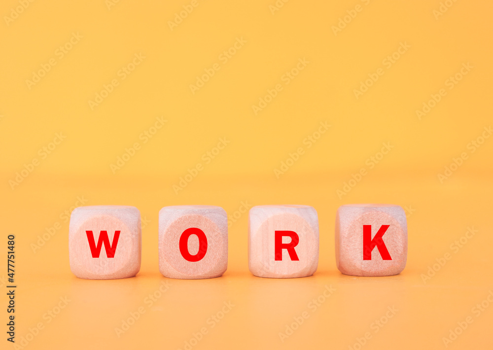 he word WORK text made with dice on yellow background he word WORK text made with dice on yellow background