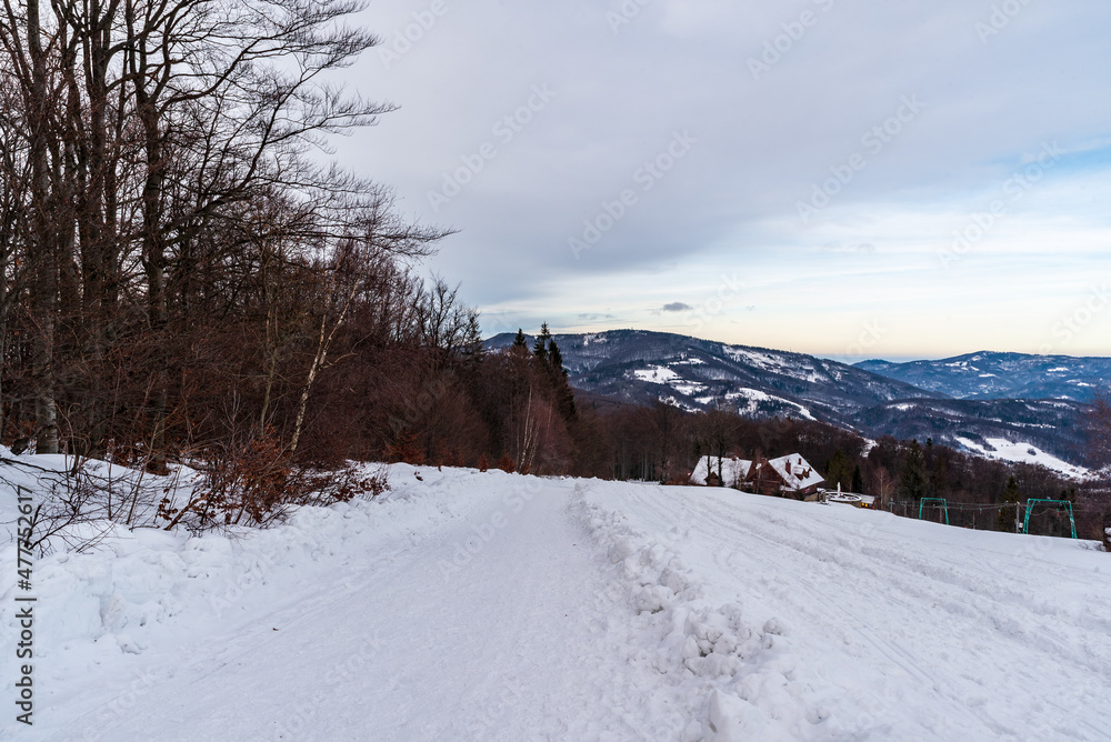 Obraz premium View from Velky Sosov hill in winter Slezske Beskydy mountains on czech - polish borders