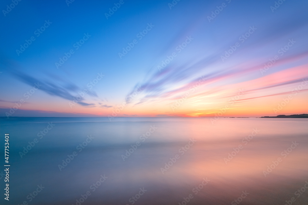 Tranquil Sunrise Sunset Long Exposure over water with beautiful gentle colors.