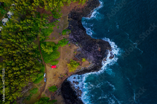 Aerial view of waves crashing against cliffs near Andrea lodges during sunset in the south coast of Mauritius island © Kestreloculus