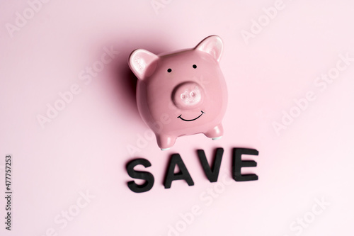 Cute piggy bank on a light background.