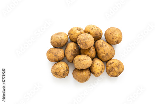 Heap of unwashed organic potatoes isolated over white. Clipping path
