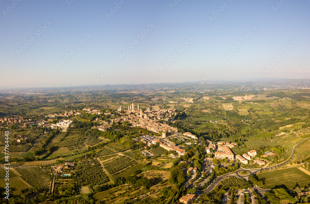 Obraz premium Aerial/Drone panorama of San Gimignano in the tuscany and its vineyards and olive trees, Tuscany Italy 