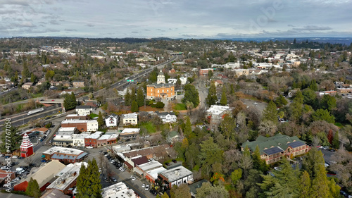 Downtown Old Auburn California with view of the Sierra Nevada Mountains. The Old Courthouse was recently renovated and is still a functioning government building.  photo