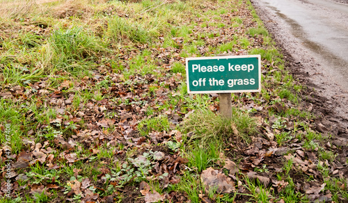 Sign requesting you stay off the grass on a roadside verge in rural Norfolk