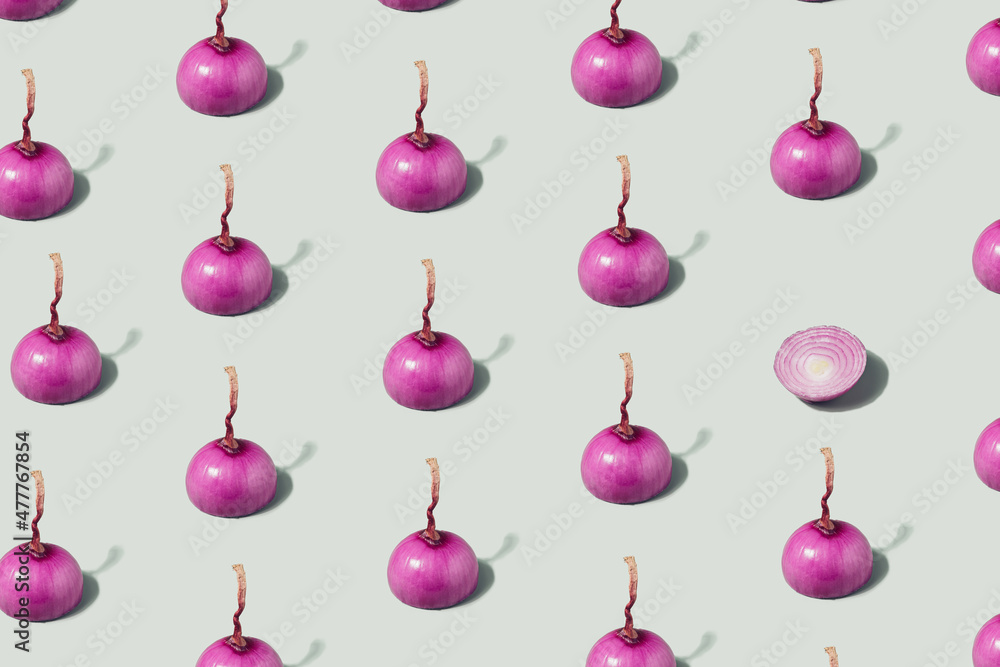 Purple cut onions pattern on a pastel green background. Healthy diet minimal concept Purple cut onions pattern on a pastel green background. Healthy diet minimal concept