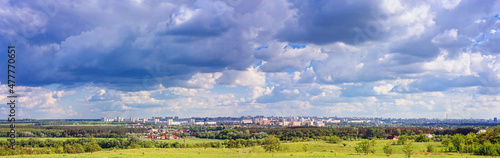 City landscape, panorama, banner. The modern city and its suburbs. View of the surroundings from the hill next to the big city