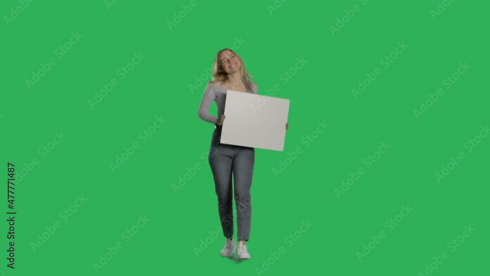 Young caucasian woman holding a blank white sign on a Green Screen, Chroma Key. 4k UHD front view isolated video Young caucasian woman holding a blank white sign on a Green Screen, Chroma Key. 4k UHD front view isolated video
