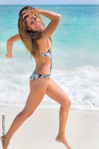 Lovely Hispanic Brunette Swimsuit Model At A Resort In The Caribbean