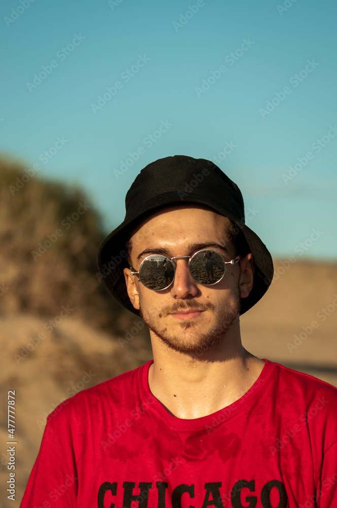 person with glasses on the beach person with glasses on the beach