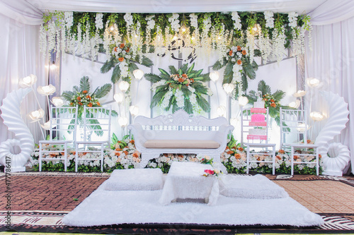 wedding decoration with white theme and fresh leaves, 15 January 2021 Tenggarong city, East Kalimantan Indonesia photo