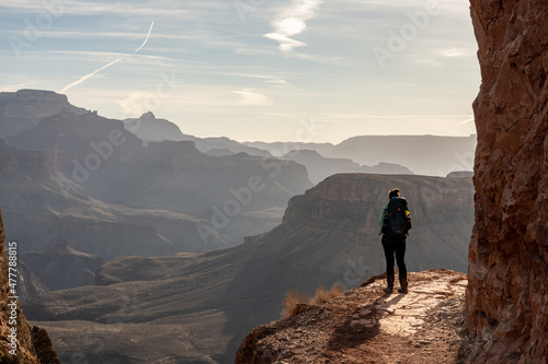 Woman Looks Out Over Grand Canyon from Trail