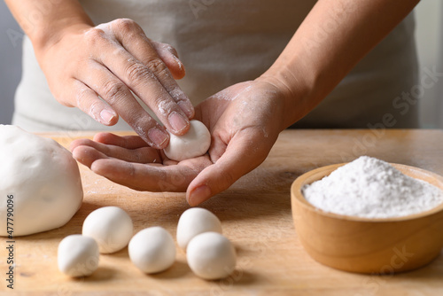 Hand making Tangyuan, Chinese dessert made of ball glutinous rice flour photo