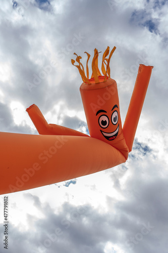 orange inflatable arm flailing tube man