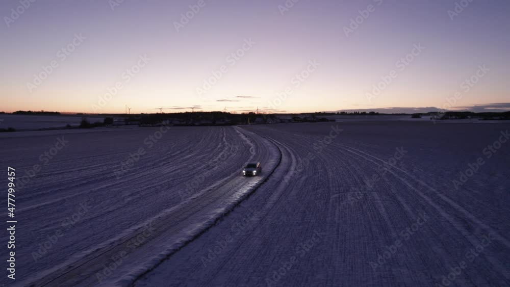 Aerial View Driving Car At Snow Covered Road In Snowy Winter Landscape Aerial View Driving Car At Snow Covered Road In Snowy Winter Landscape